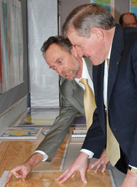 Fig 1. Minister for Industry, Tourism and Resources, the Hon Ian Macfarlane, MP viewing some of the acreage release data. 