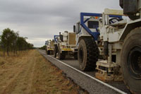 Fig 2. Seismic vibrator trucks operating between Croydon and Georgetown, northwest Queensland. 