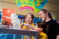 Jessica and Grace Fryer explore Geoscience Australia assisted by Education Officer Anna Paull.