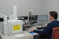 Geochronologist, Andrew Cross, uses a Scanning Electron Microscope to identify tiny monazite crystals. Copyright Geoscience Australia 2012