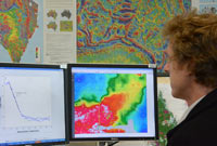 Geophysicist, Tony Meixner, using the computer software to create the depth to magnetic basement map for the Arunta-Georgina-Amadeus-Musgrave region