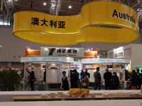 Two circular booths under a large banner with the word &ldquo;Australia&rdquo; in English and Chinese
