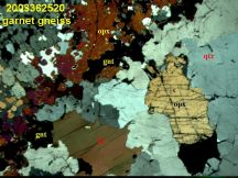 Photomicrograph of garnet-opx gneiss sample 2003362520 - click to enlarge (75 KB).
