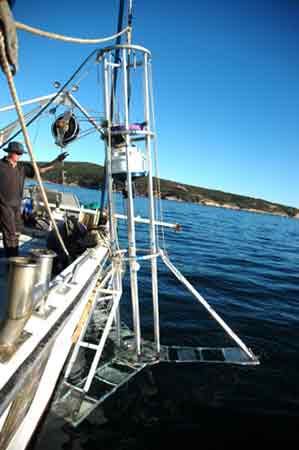 Image of submersible vibracoring system being deployed from the side of FV Jumbo II, Esperance Bay, Western Australia.