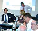 Group of people around a table at the ACRES 2005 Distributors meeting