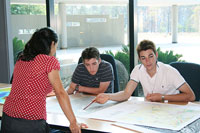 Geoscience Australia scientist Leharne Fountain assists National Youth Science Forum students interpret geophysical data 