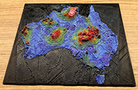 A photo of a 3 dimensional printed model of Australia illustrating gravity and geothermal dataset