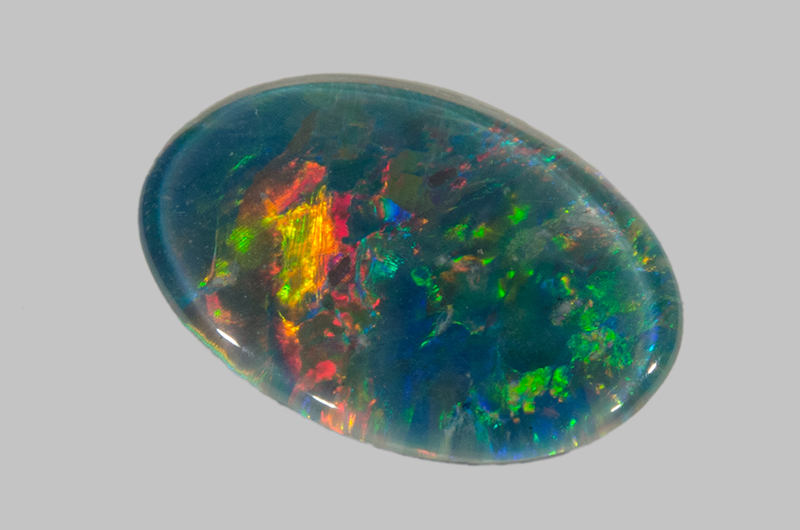 Rounded colourful opal gemstone