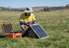 Man installing sensors in a field