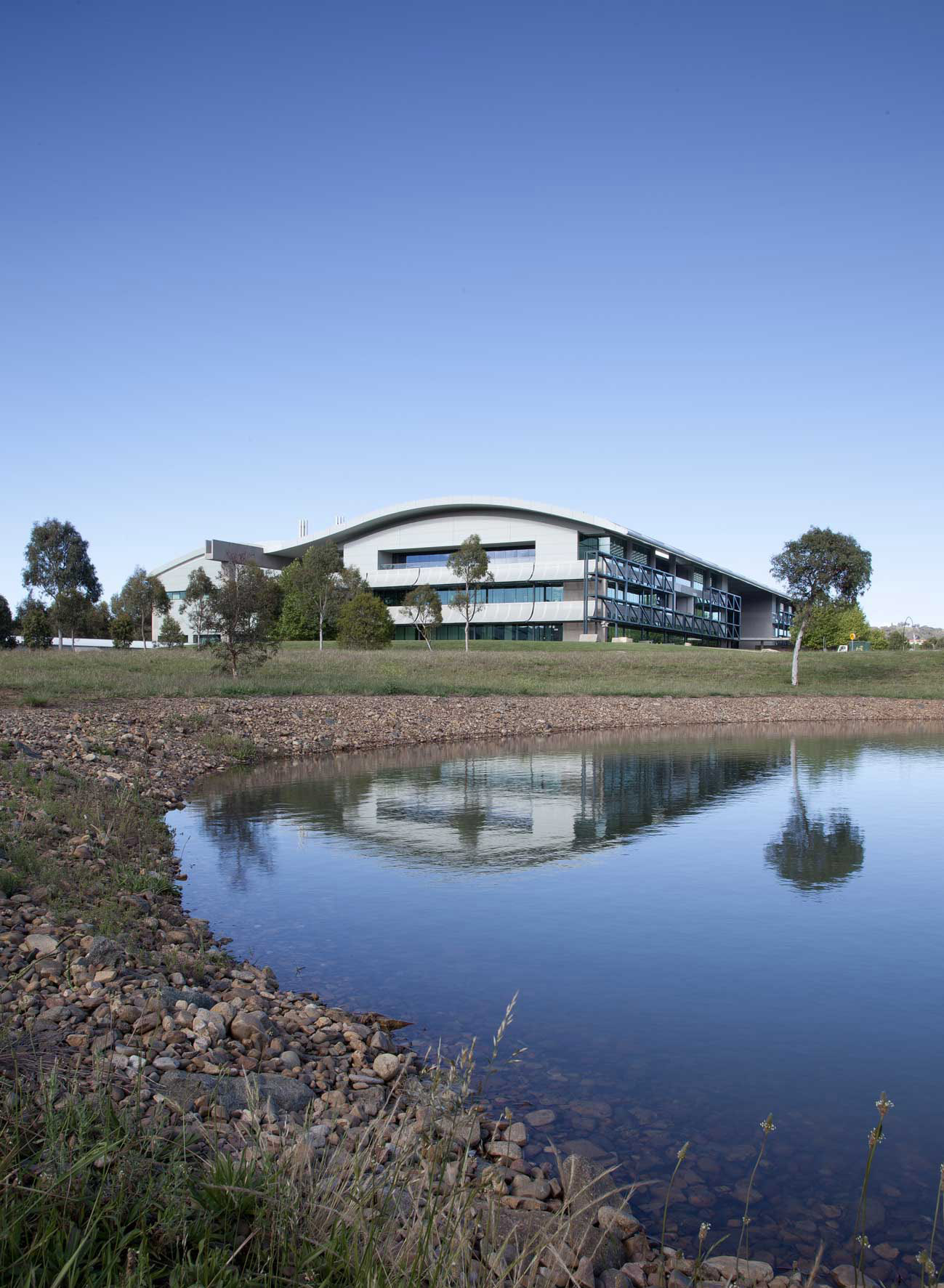 Exterior photo of the Geoscience Australia building under a blue sky
