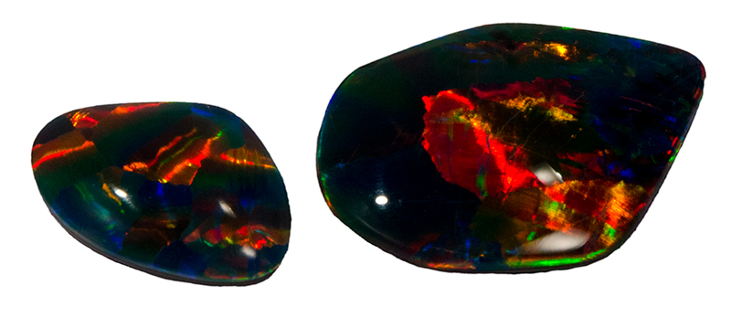 Two rounded colourful opal gemstones