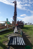 A stratigraphic drilling rig recovering drill core samples