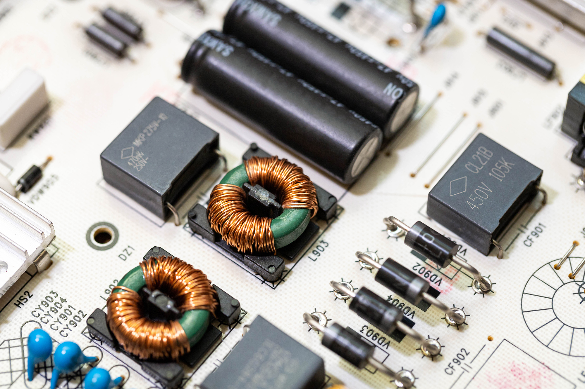 Close-up view of a circuit board with integrated capacitors and resistors.