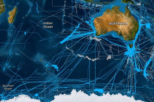 Map of Australia and surrounding oceans showing the network of collaborative seabed mapping survey tracks collected through the AusSeabed initiative