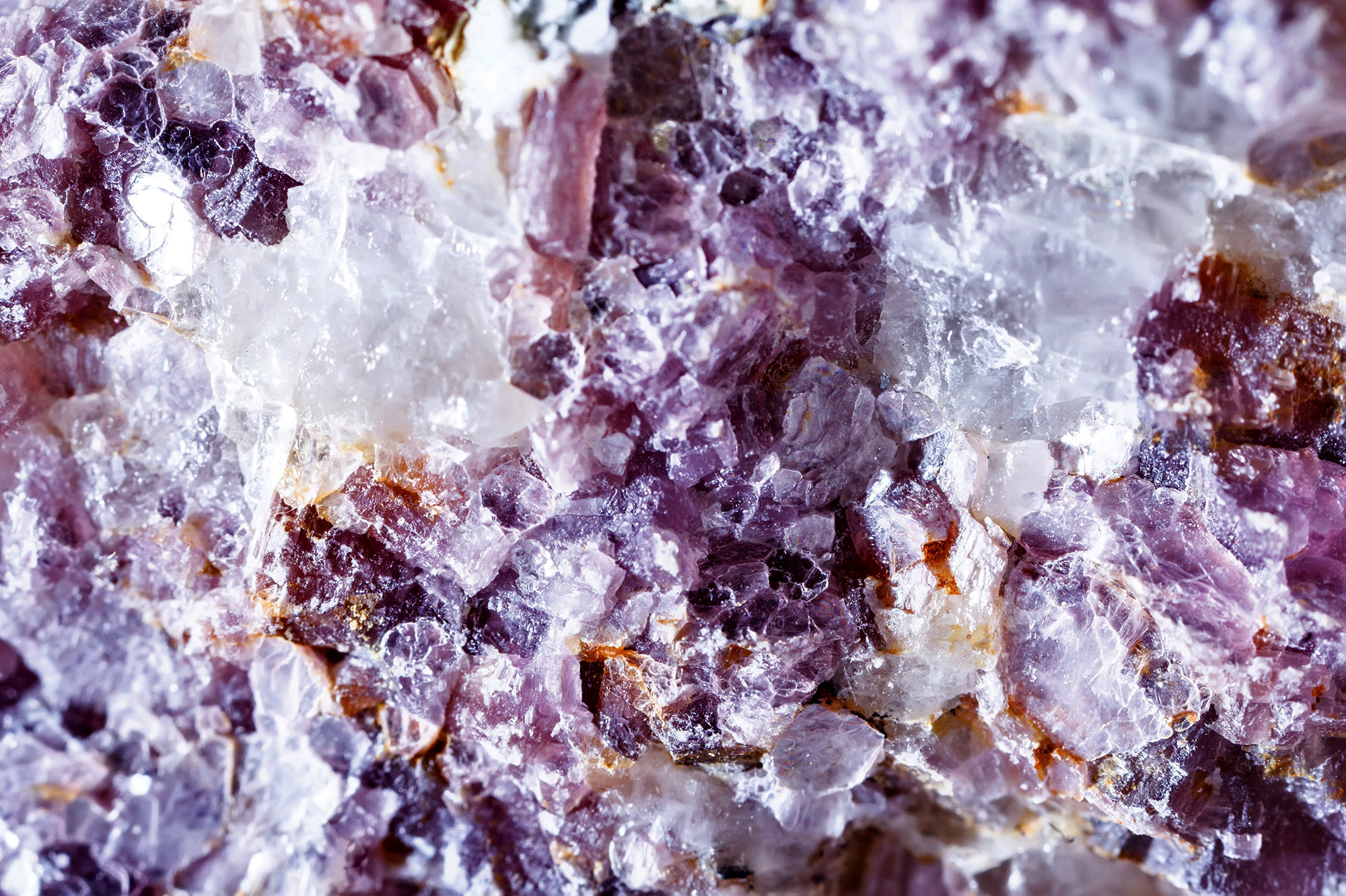 Macro shooting of natural gemstone. Raw mineral lepidolite. The texture of the stone. Abstract background.