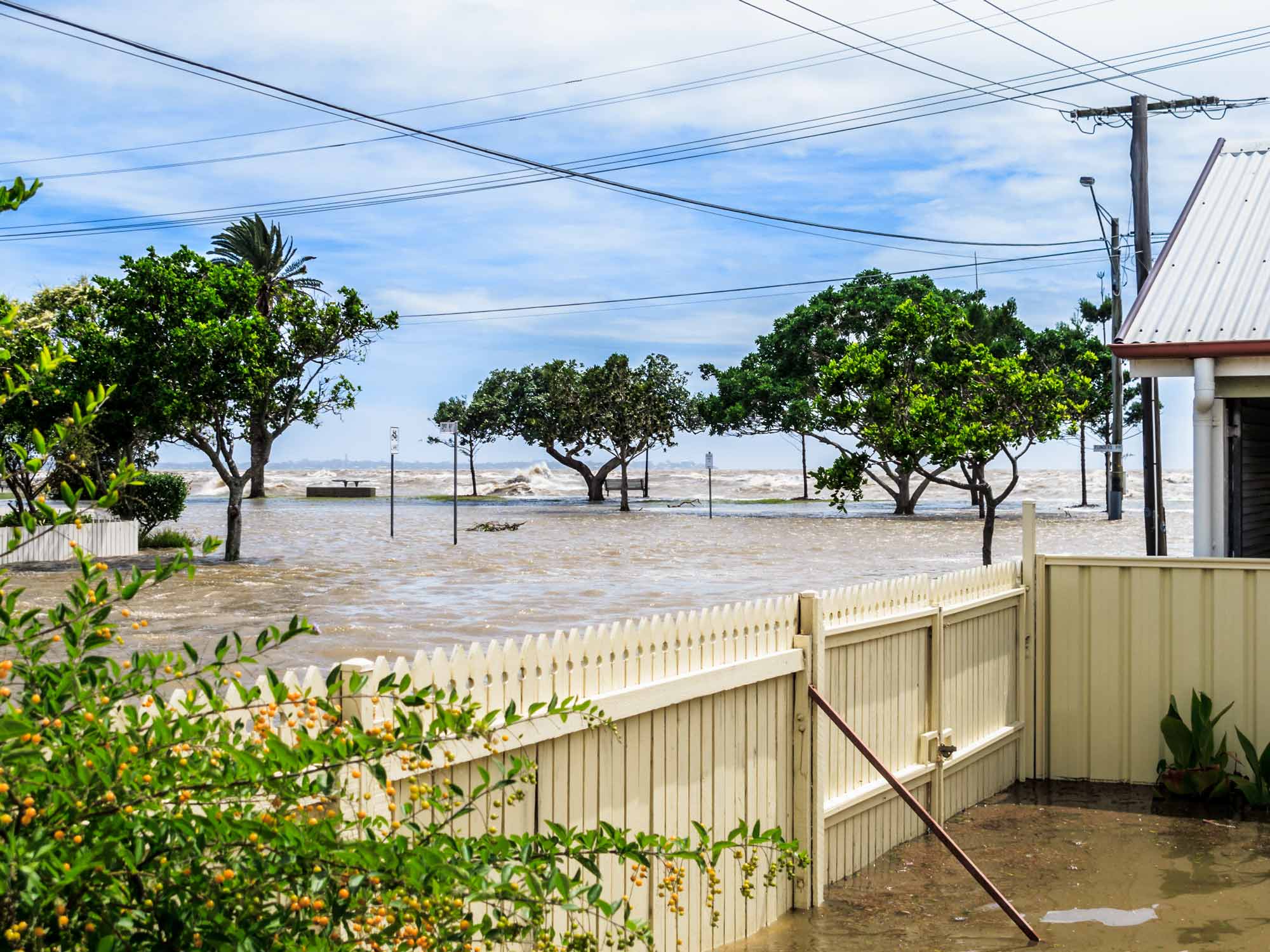 Coastal flooding inundates residential streets and properties during a severe storm event