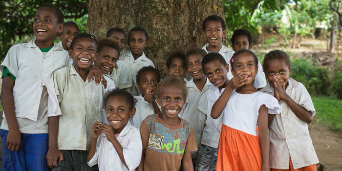 A photo of a group of young Pacific islander children