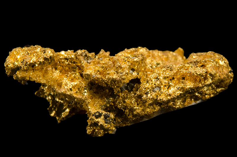 A rock comprised mostly of gold metal