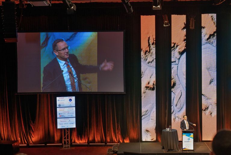 Geoscience Australia CEO James Johnson speaking at the Locate 2022 conference