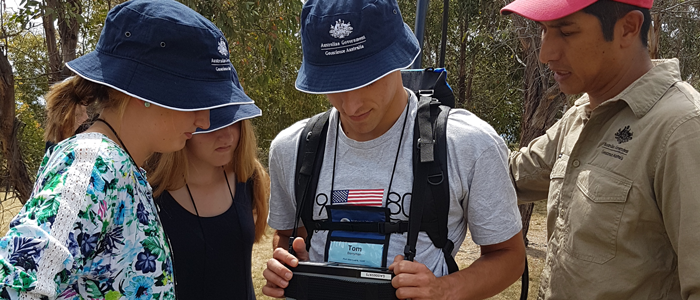 High-school students use scientific equipment to undertake a geophysical survey