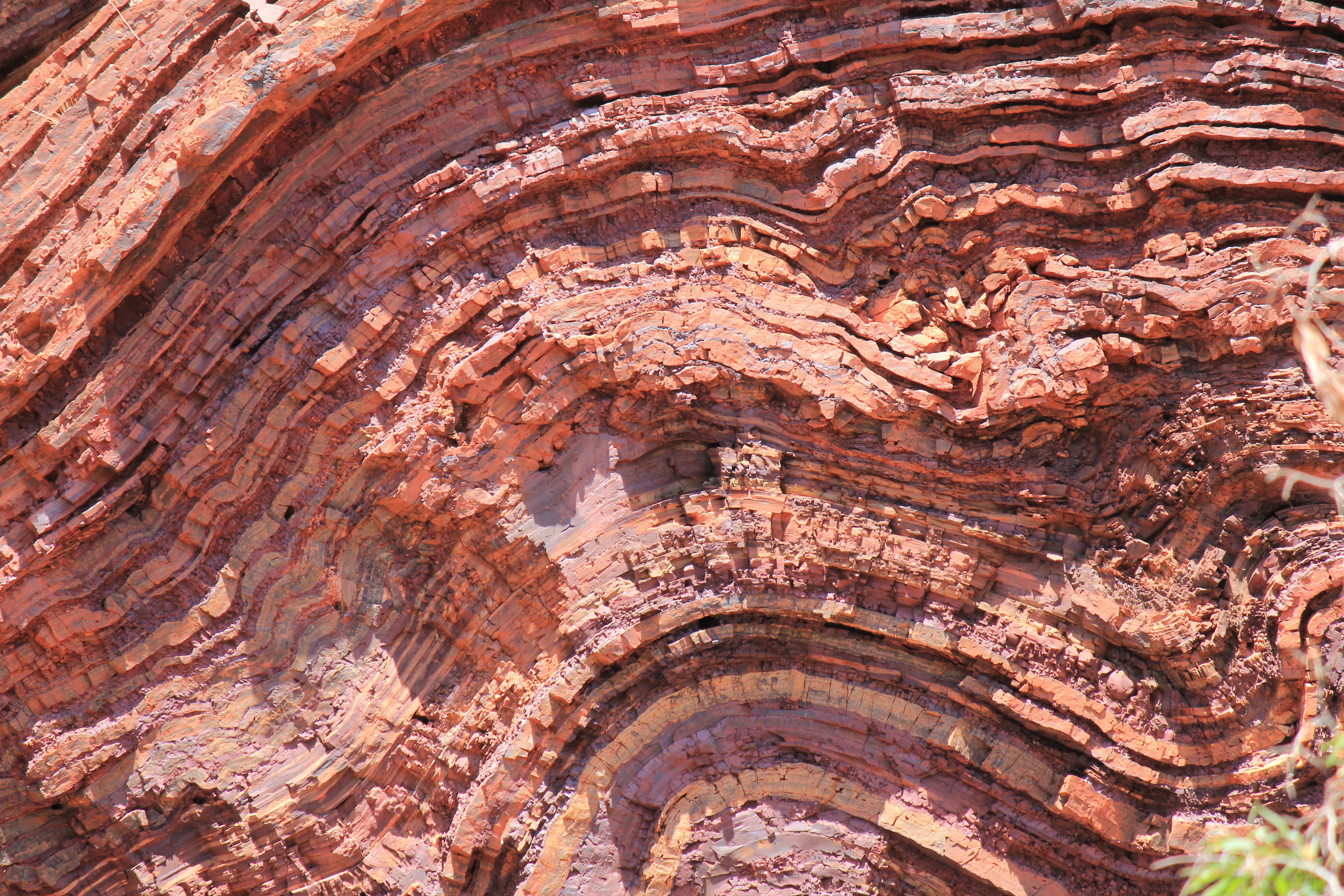 Pink and red coloured  folded rock formation