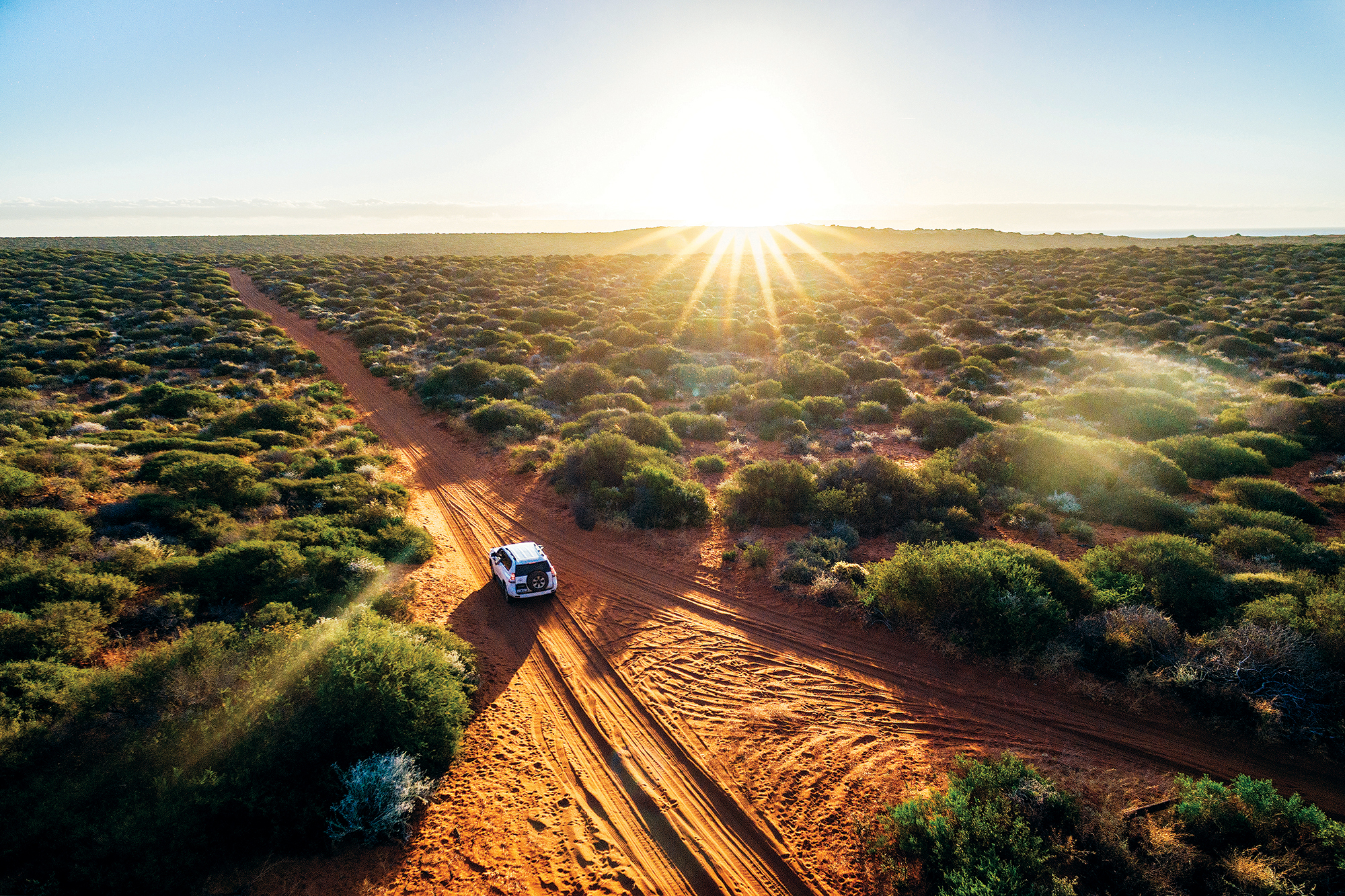 Driving off-road in Western Australia at sunset, aerial view. Francois Peron National Park