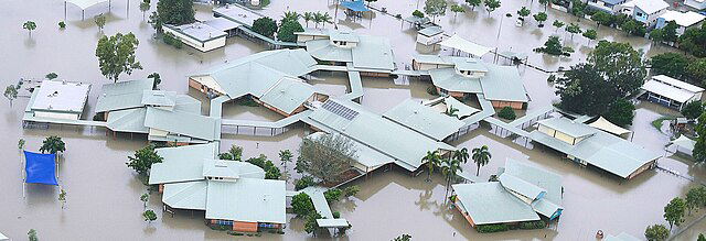 An aerial image of a flooded school.