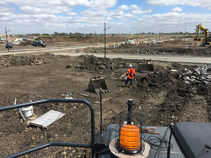 Construction worker standing in a building site