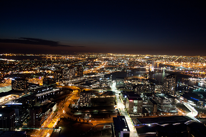 Image of city lit up at night, powered by electricity