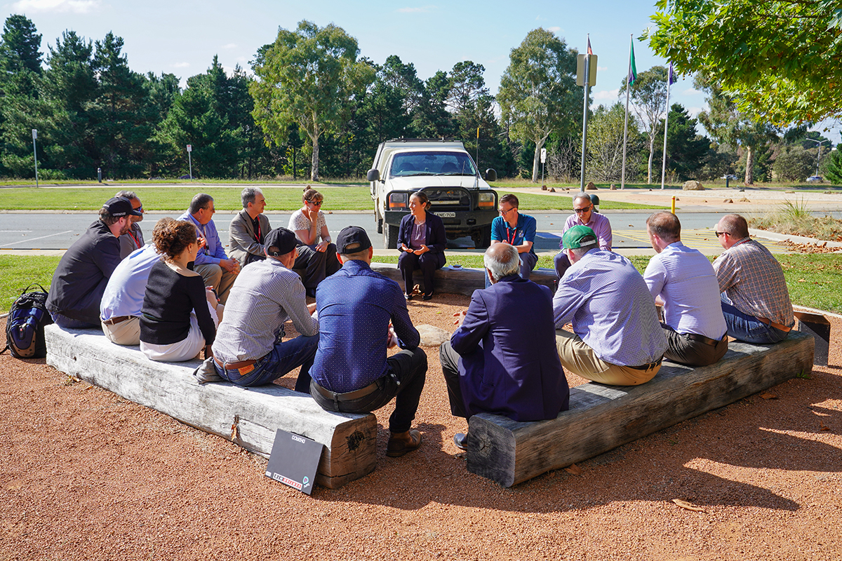 Alison Rose, Chief of Place, Space and Communities Division leads discussions with USGS partners around Geoscience Australia’s Yarning Circle.