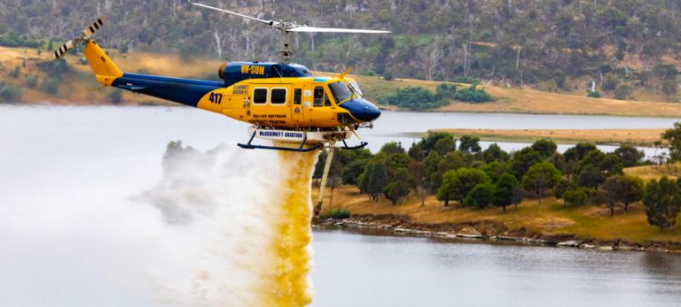 Helicopter engaged in aerial firefighting