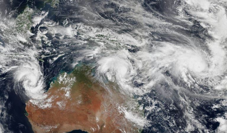 Satellite photo of the Australian continent with a cyclone moving across Queensland