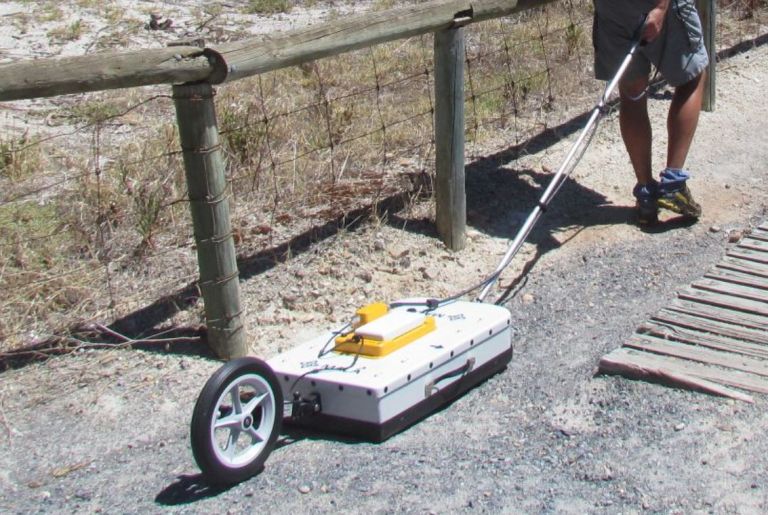 Ground penetrating radar in use outside on a dirt path
