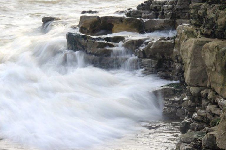 Waves crashing against rocks