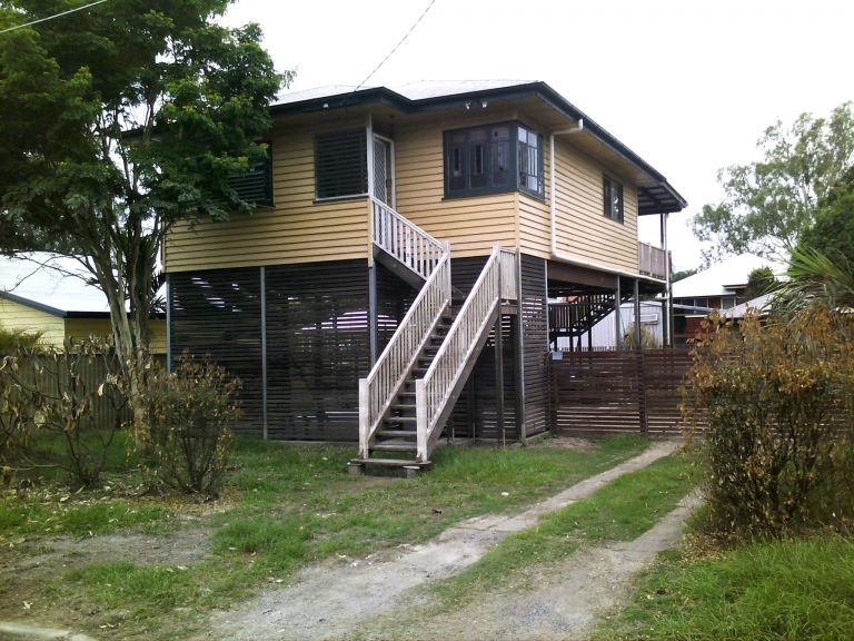 House with stairs leading up to the front door
