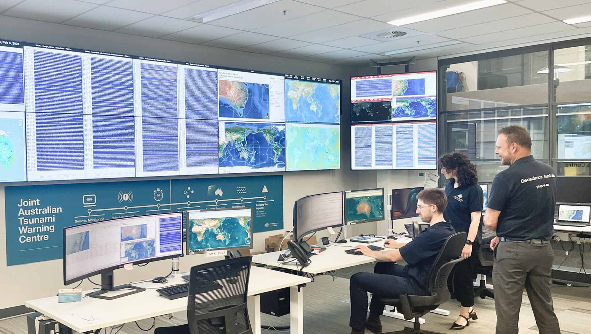 Staff in the National Earthquake Alerts Centre room at Geoscience Australia
