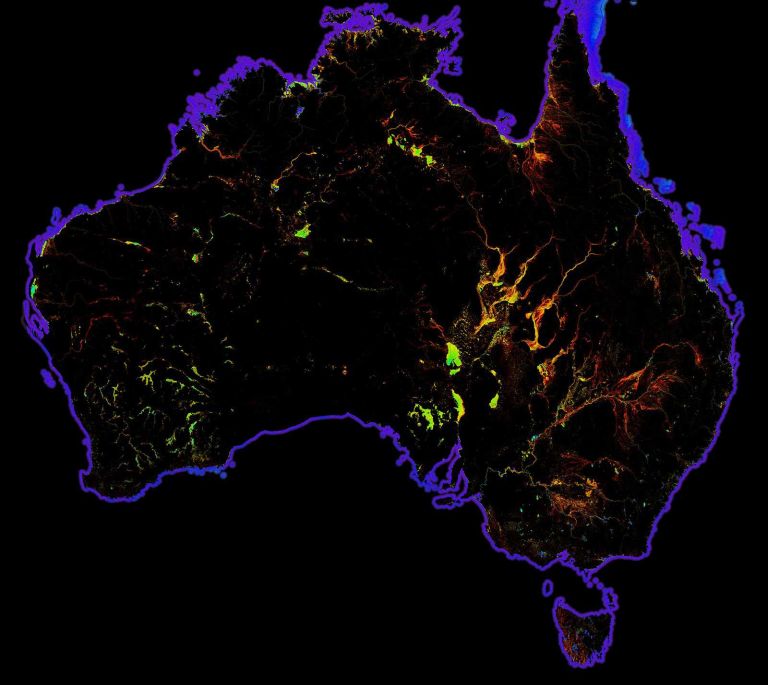 Abstract image of black Australian map with purple and yellow highlights at coast and sporadically inland.