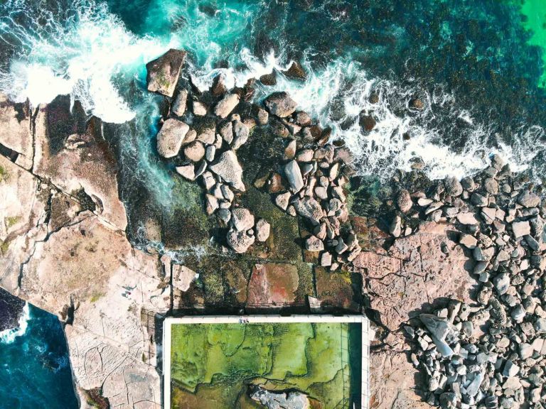 Edge of a rectangular rock pool on coastal prominitory