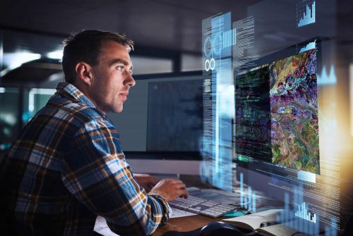 man looking at image on computer