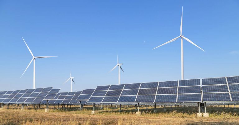 Solar cells or solar panels or photovoltaic cells with wind turbines generating electricity alternative renewable wind energy and sunlight energy in hybrid power plant station