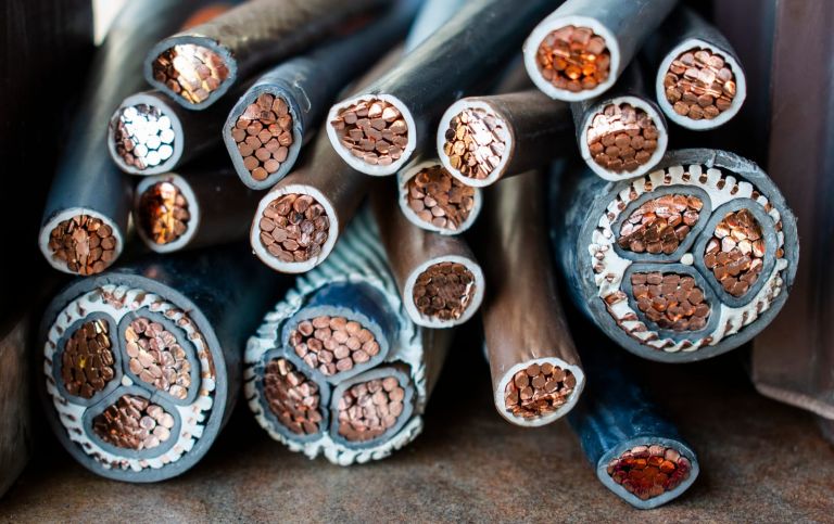 Copper cables covered with rubber on a pile stock photo