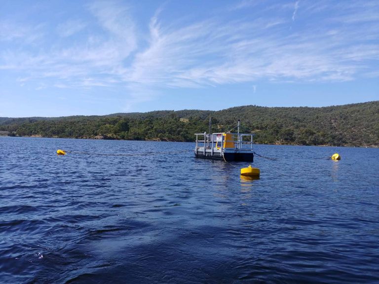 Pontoon with scientific measurement equipment floating on lake