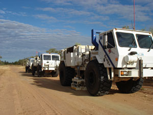 Fig 2. IVI Hemi60 Vibroseis trucks working along traverse 07GA-IG1.