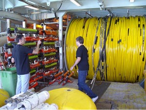 Fig 1. The 8 kilometre solid streamer, tail buoy and stabilizer 'birds' being inspected prior to the start of the Southwest Margin 2D seismic survey.