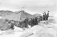 Fig 1. Members of the Australasian Antarctic Expedition (1911-14) celebrating the completion of the hut (Photograph by Frank Hurley).