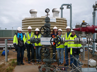 Fig 1. The test team gather around the head of the injection well at the CO2CRC Otway Project during the dissolution test in September 2011.
