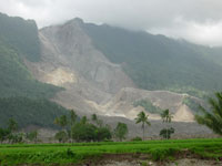 Fig 1. View of the landslide from the nearby search and rescue base camp.